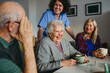 © Halfpoint - Old people having good time together in community center.