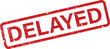 © NasimaH - A strong red stamp illustrates the word DELAYED within a gritty rectangular border on a plain white surface