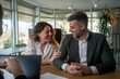 © Nenad - Family couple consultations with a lawyer or insurance agent.