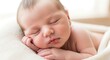© Roushon - Adorable newborn baby sleeping peacefully on a soft white blanket, capturing the innocence and tenderness of early childhood in a gentle, warm light.