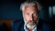 © svastix - A close-up portrait of a mature man with captivating blue eyes and a full beard, embodying wisdom and a serious demeanor that speaks volumes about his life experience.