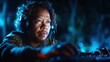 © svastix - A dedicated music producer is immersed in his craft, creating sounds carefully while the beautiful bluish light enhances the atmosphere in the dimly lit room.