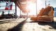 © Bonsales - Safety boots standing on an industrial site floor, representing hard work, dedication, and professional commitment