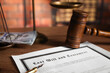 © New Africa - Last Will and Testament, pen, gavel and money on wooden table, closeup