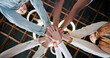© MagicDavid25/peopleimages.com - People, meeting and unity with hands together below for collaboration, inclusion or mission. Low angle, group or creative community with pile or stack in solidarity, huddle or circle for teamwork