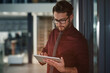 © JamPacked/peopleimages.com - Businessman, tablet and scroll for review at office with checklist, project and notes at insurance company. Person, advisor and broker with app, notification and feedback at risk management agency
