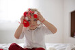 © Tomsickova - Cute child, blond boy, playing with white and red bracelet