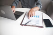 © Supitnan - Closeup hand of businessman, accountant, banker working at office