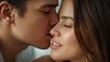 © Future Vision - Leaning man on left and woman on right sharing gentle kiss in bedroom, light shirt, strapless