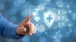 © CuteBee - A man's hand interacts with a futuristic holographic interface displaying a prominent shield and medical cross icon, surrounded by healthcare and protection symbols.