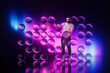 © Rendara Studio - Man interacting with floating purple 3D spheres in studio scene