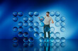 © Rendara Studio - Man interacting with floating blue 3D spheres in studio environment