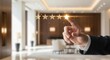© Eve - Businessman hand choosing five star rating in luxury hotel lobby background. Concept of premium hospitality service, customer satisfaction, and excellence in tourism. High quality evaluation.