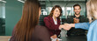 © Stock 4 You - Group of corporate people happy with results of team work at meeting. Mature worker woman shaking hand with client, recruit employee or business partner after signing contract. Web banner, copy space