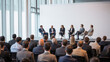© Jasmine - Interview and round table discussion at business convention and presentation. Audience at the conference hall. Business and entrepreneurship symposium.