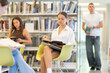 © JackF - Young female student reading book while sitting on chair in library