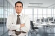 © BillionPhotos.com - Happy professional business man standing in office