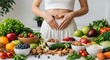 © Tulippp - Promoting Gut Health Hands form heart over stomach, surrounded by fresh, natural foods for overall wellness
