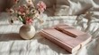 © Mas - Flowers in vase and notebook on bed