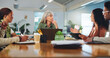 © peopleimages.com - Creative agency, laptop and people in office, meeting and conversation for project schedule. Group, listening and employees in workplace, cooperation and pc for online review and feedback for pitch