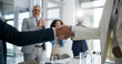 © MagicDavid25/peopleimages.com - People, meeting and handshake with applause in office for welcome, partnership and congratulations. Team, shaking hands and staff clapping for greeting, celebration and agreement for promotion winner