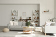 © Pixel-Shot - Interior of light living room with grey sofas, tables and shelf units