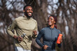 © littlewolf1989 - Happy black couple running together outdoors for fitness
