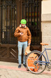 © Oscar - Courier delivering food using bike and smartphone