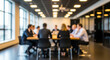 © Rahman - Blurred business meeting in modern office with diverse professionals collaborating around a large conference table, discussing strategies and ideas for future growth and success