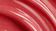 © PhotoLuxeStudio - Glossy red lip gloss texture with sparkling glitter spread in smooth curves, creating vibrant and shiny effect