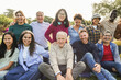 © DisobeyArt - Group of multigenerational people smiling in front of camera - Multiracial friends of different ages having fun together - Main focus on center senior man face