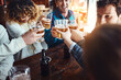 © peopleimages.com - Friends, cheers and restaurant with fun celebration and reunion with beer at a pub or bar with happy people. Group, glasses and smile with drinks toast for event or birthday together with laugh