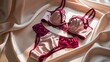 © Kavindu - Elegant satin lingerie set in pink and red, styled on silky fabric with soft lighting, luxurious intimate fashion