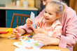 © Maria Vitkovska - Mother and daughter enjoying creative art activity at home