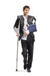 © Ljupco Smokovski - Injured man in a ripped suit wearing arm sling and using crutches