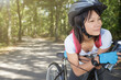 © auremar - portrait of happy young woman wearing a bike helmet
