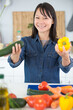 © auremar - smiling young woman holding vegetables
