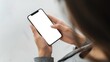 © VolumeThings - Anonymous woman on her phone with a blank screen. Overhead shot of hands holding a smartphone, using an app, chatting, and scrolling