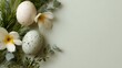 © progressman - Two eggs with speckles on them are on a green background