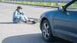 © Михаил Решетников - A Caucasian woman on a scooter after being hit by a car.