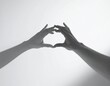 © ratihms04 - Romantic Hand Heart Symbolism in Minimalist Monochrome Style