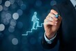 © Lianlian Liang - Businessman hand drawing a white staircase with a blue marker and a sketch of a human figure climbing upwards, representing career planning, personal growth, and ambition