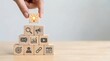© CuteBee - A hand places a lightbulb block on a pyramid of marketing and business symbols, representing innovation, new ideas, and strategic solutions for business success.
