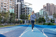 © leungchopan - Woman run on track during outdoor exercise