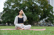 © leungchopan - Woman enjoy pranayama session at outdoor
