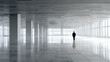 © CStock - A solitary figure stands in a spacious, modern interior with sleek lines and expansive windows, conveying solitude.