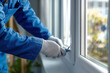 © filmanana - Measure Tape Worker in Blue Uniform Installing Window Frame with