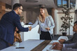 © Dragana Gordic - Professional Handshake Between Colleagues During Business Meeting in a Modern Office Setting