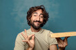 © kues1 - young adult bearded man with an empty wooden cutting table