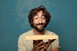© kues1 - young adult bearded man with an empty wooden cutting table